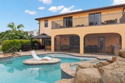 Stunning Waterfront Villa in Cape Coral with Lagoon Style Pool Spa and Boat Lift